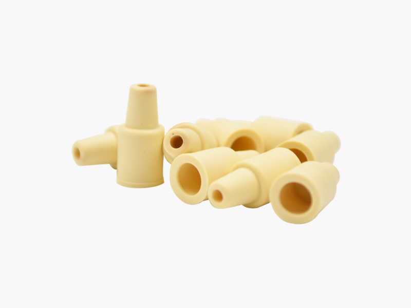 Set of beige pheromone lures on a white background
