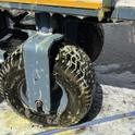 Large wheel with metal hub on a flatbed truck