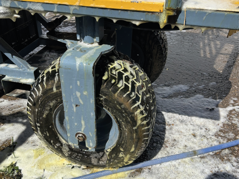 Large wheel with metal hub on a flatbed truck